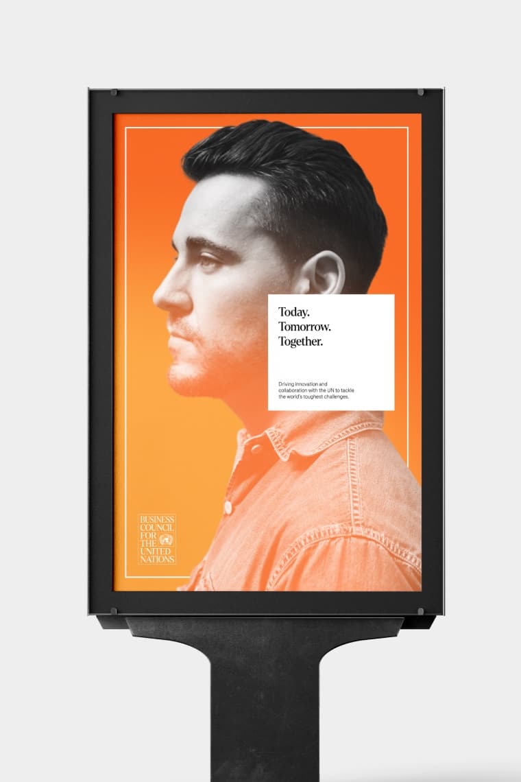 A Business Council for the United Nations poster on a stand: a portrait on orange