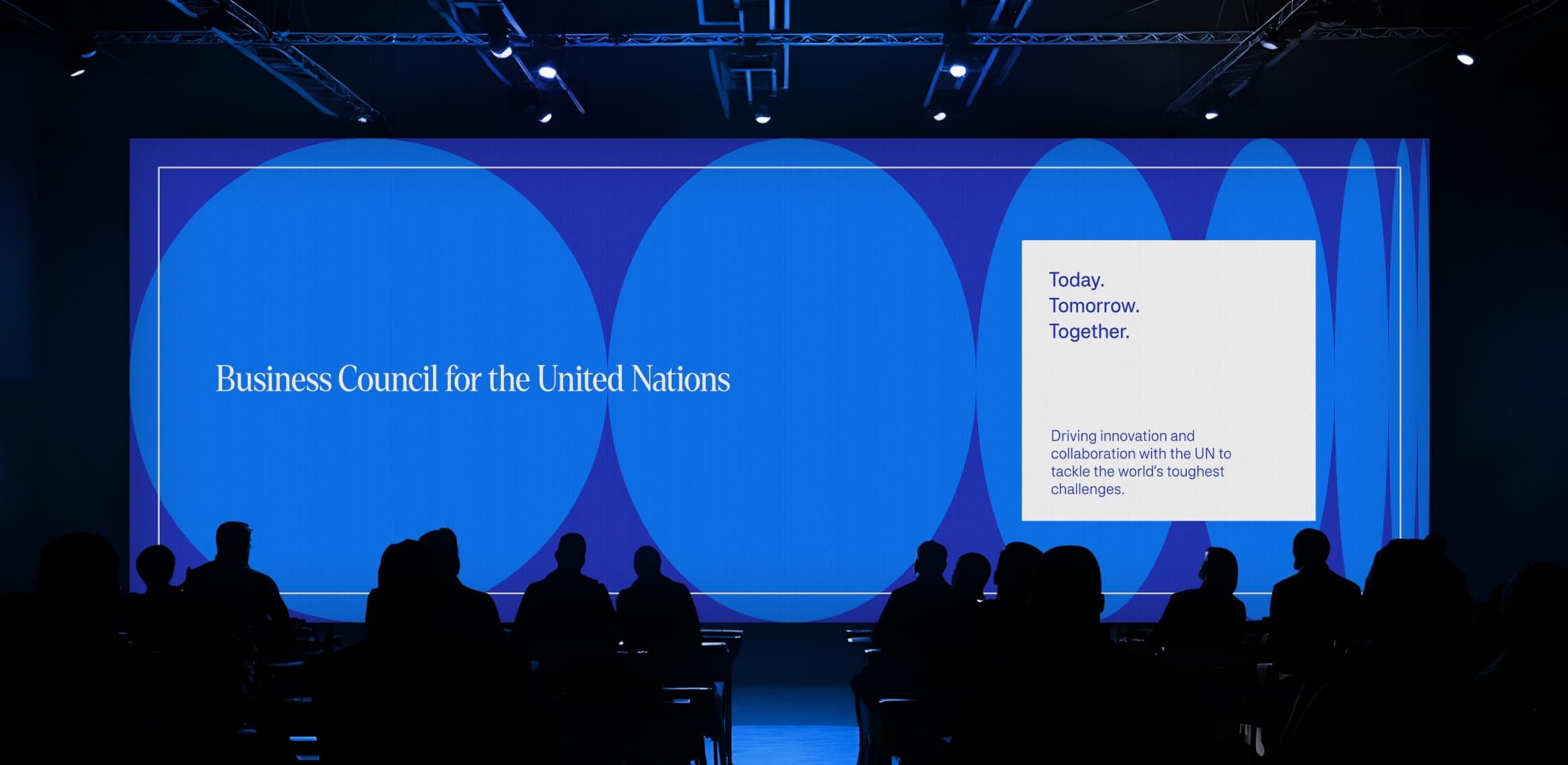 A Business Council for the United Nations event: the brand on stage screens in front of an audience