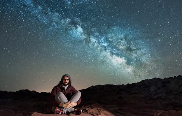 Sitting under the Milky Way on a night shoot