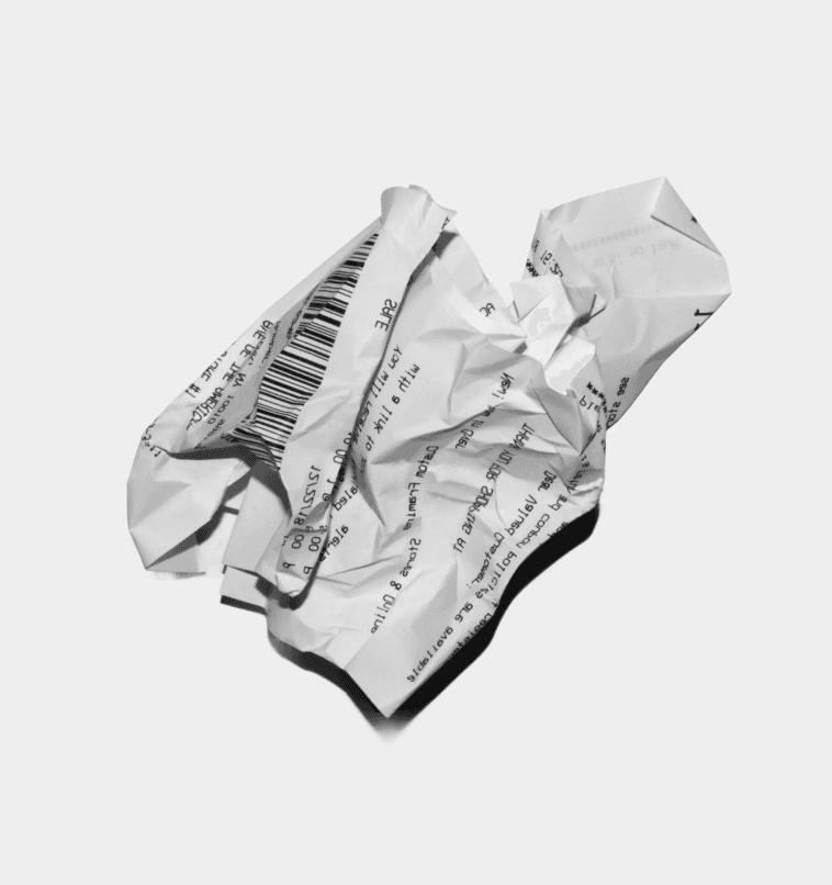A crumpled sheet of paper in black and white